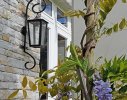 Climbing Wisteria softens and complements the architecture